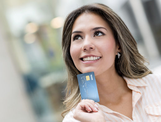Woman holding debit card